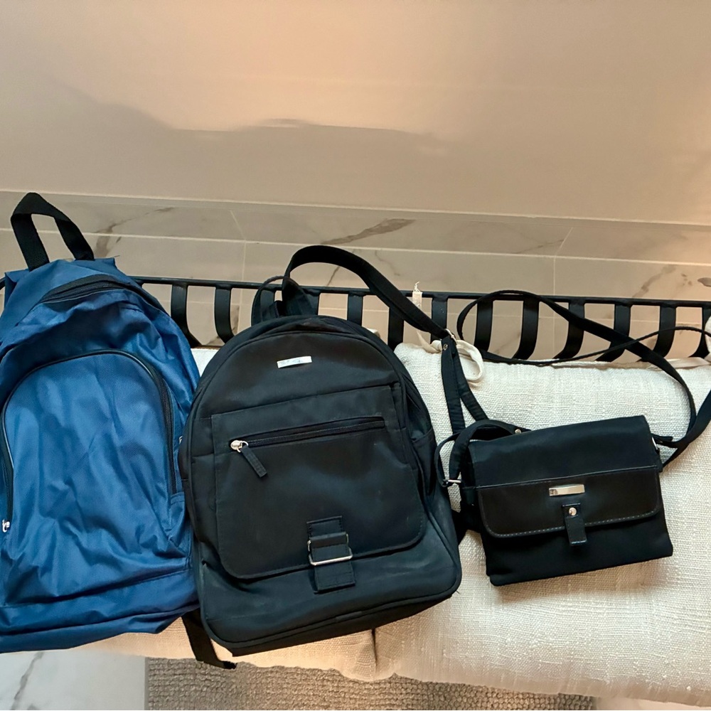 Three handy and stylish backpacks and small purse.